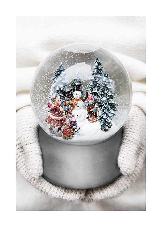  – Fotografie einer kleinen Schneekugel mit Schneemann, Bäumen und Kindern